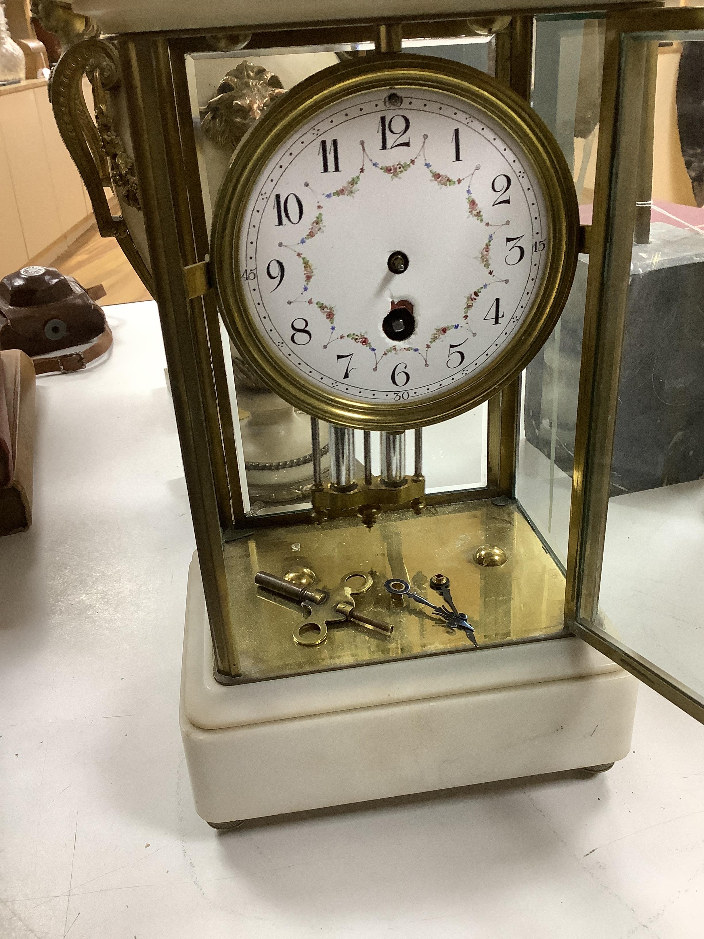 A French lacquered brass and marble, enamelled dial, four glass mantel clock, 30cm high